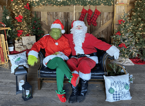 2023 Christmas on the farm, the Grinch and Santa sitting on a bench