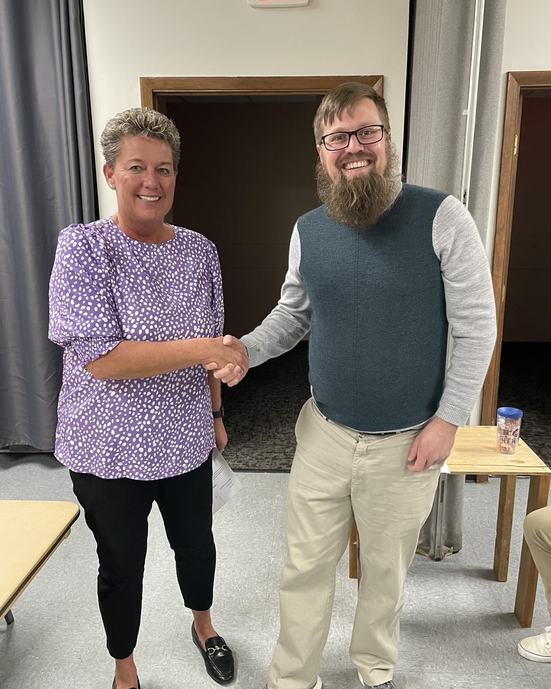 Deputy Director Amanda Langois Shaking hands with new Board of Commissioners member, Scott Chaplinski